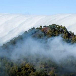 Cloud waterfall phenomenon in La Palma. La Palma - The Hidden Gem of the Canary Islands, article by Kiss My Backpack at https://www.kissmybackpack.com/