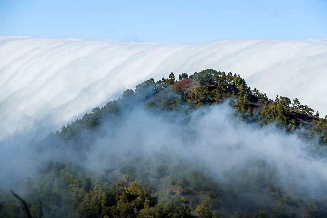 Cloud waterfall phenomenon in La Palma. La Palma - The Hidden Gem of the Canary Islands, article by Kiss My Backpack at https://www.kissmybackpack.com/