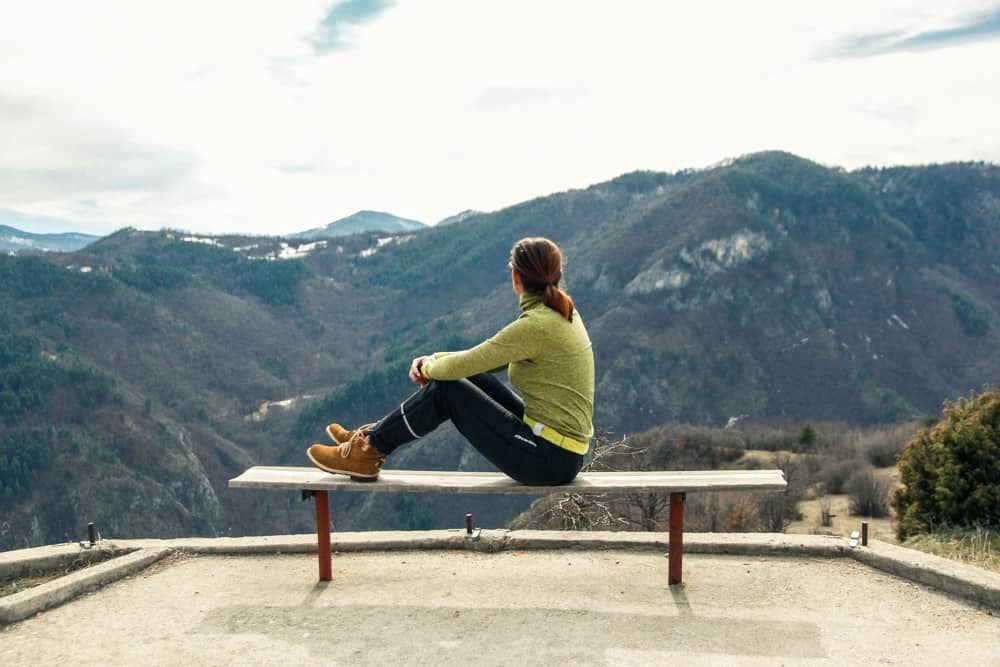 A girl mesmerised by the green mountains in Rhodope Mountains, Bulgaria