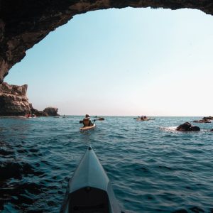 A kayak nose looking towards the Black Sea from the inside of a cave in Tyulenovo