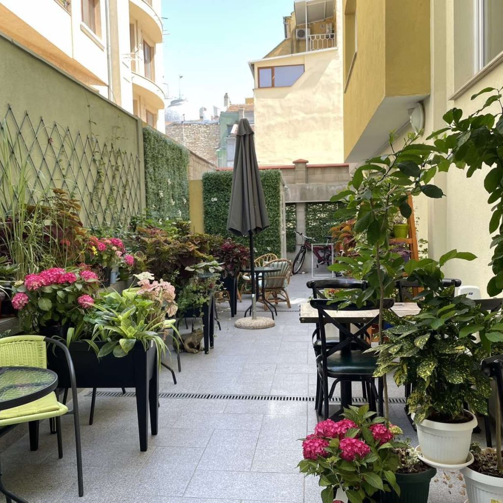 outdoor terrace in Art Green Hotel - rated best pet-friendly hotel in Varna - leading to an affiliate link in booking.com 