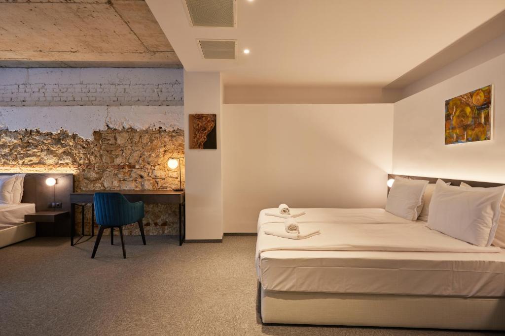 A bedroom in the Bizarre boutique hotel - rates best boutique hotel in Varna - leading to an affiliate link in booking.com