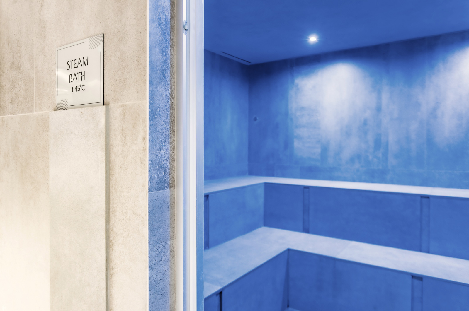 Blue lighted steam bath in Hotel Therma Numera leading to a booking affiliate link