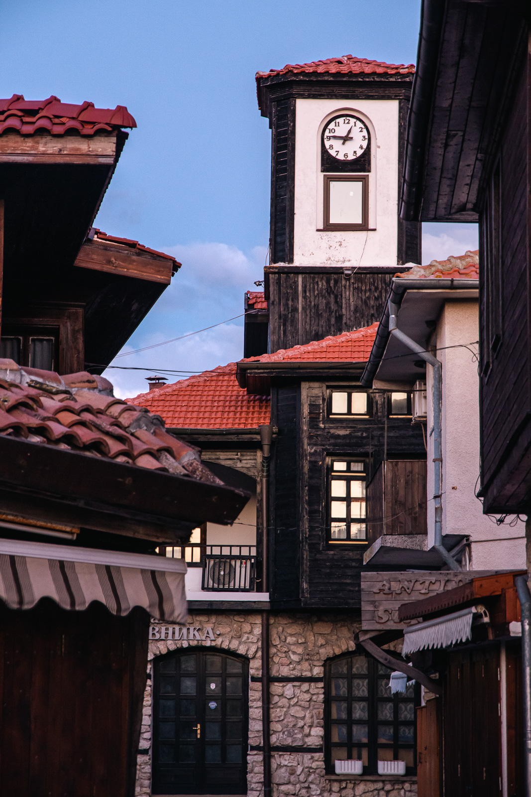 authentic old style Black Sea houses and a clock in Nessebar
