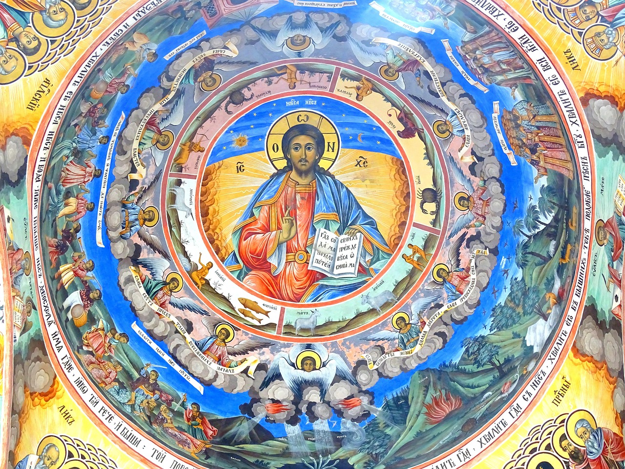colorful religious frescoes with Jesus Christ in one of the domes in Rila Monastery