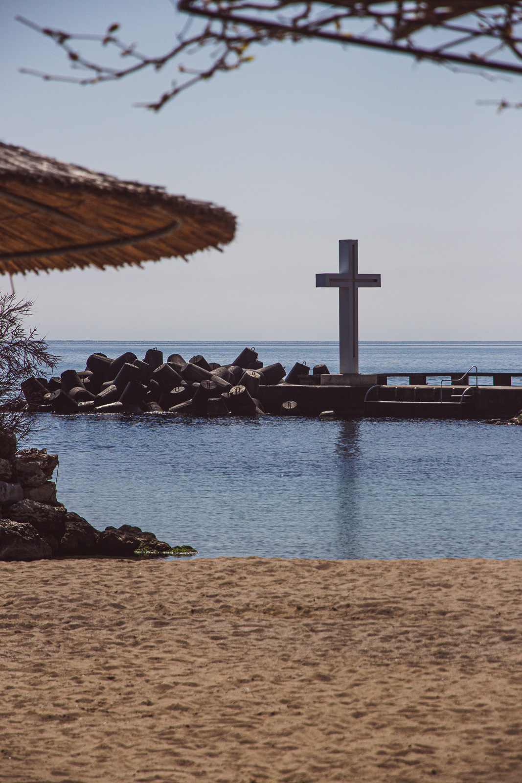 A beach and the cross on the embankment in St. Constantine and Helena
