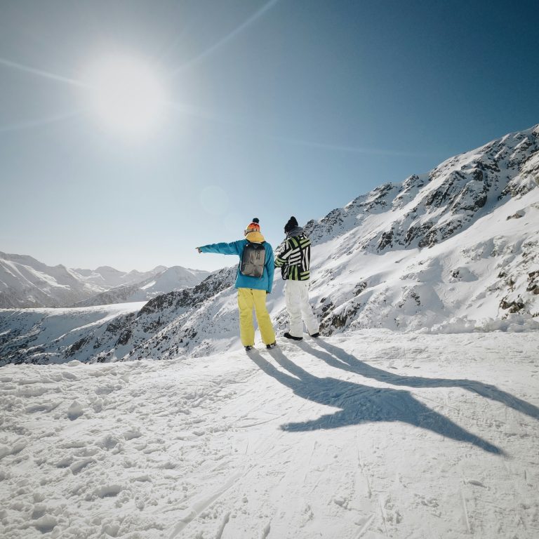 two skiers on a sunny day in one of Bulgaria's largest ski resorts - Bansko