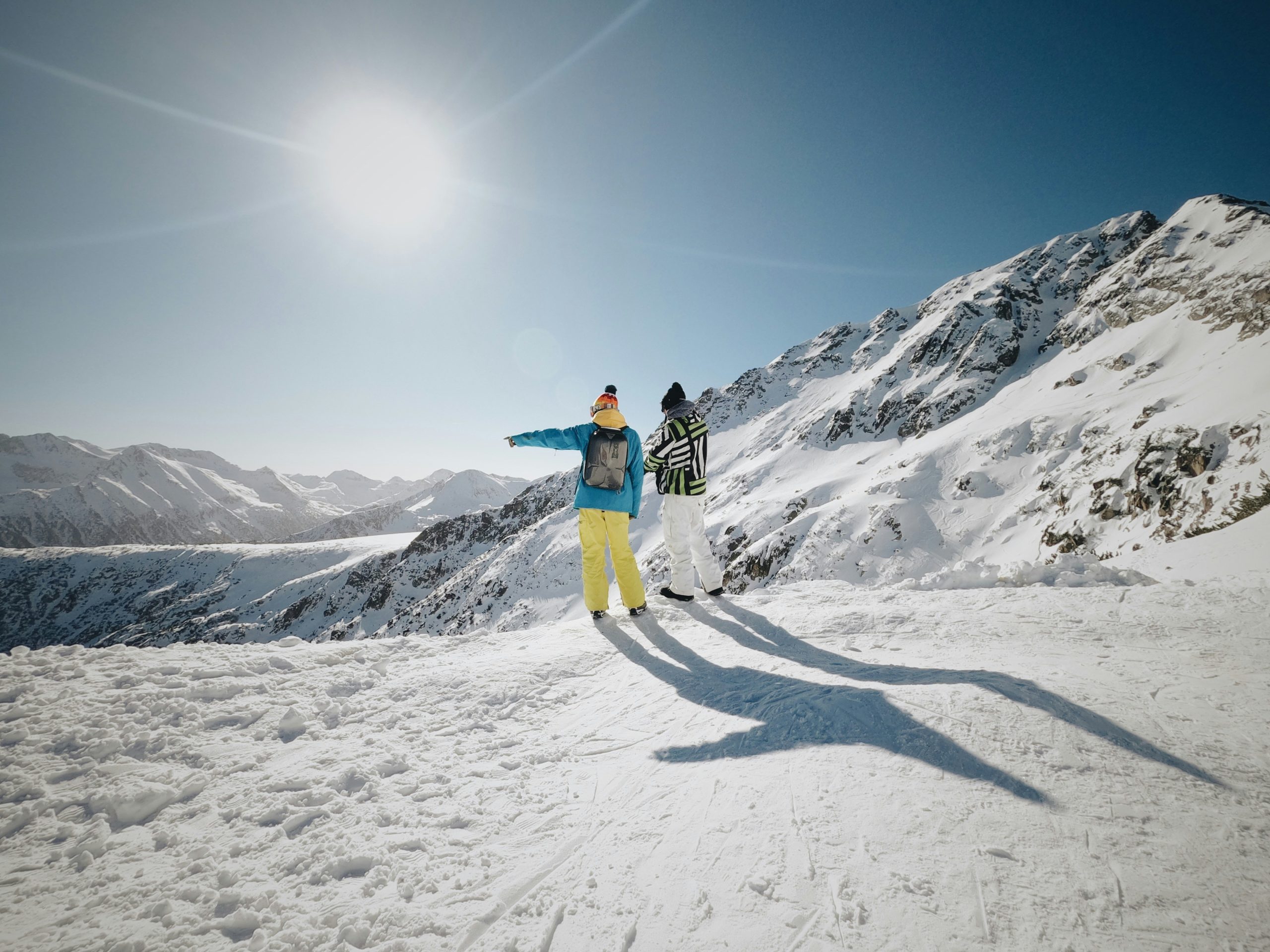 two skiers on a sunny day in one of Bulgaria's largest ski resorts - Bansko