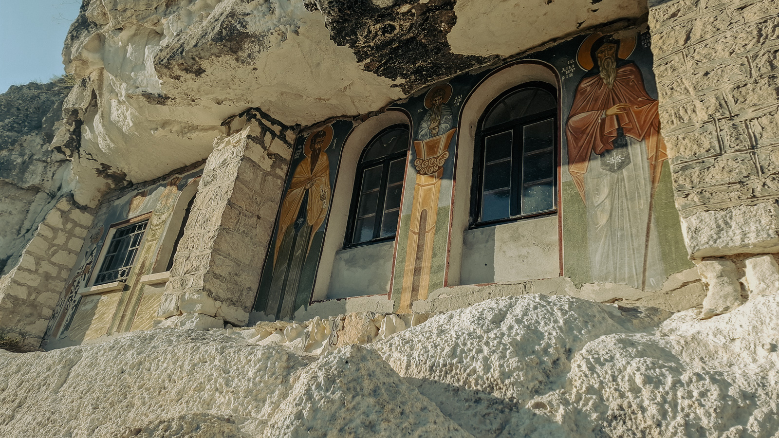 the upper part of the stairs with icons drawn on the cut rocks