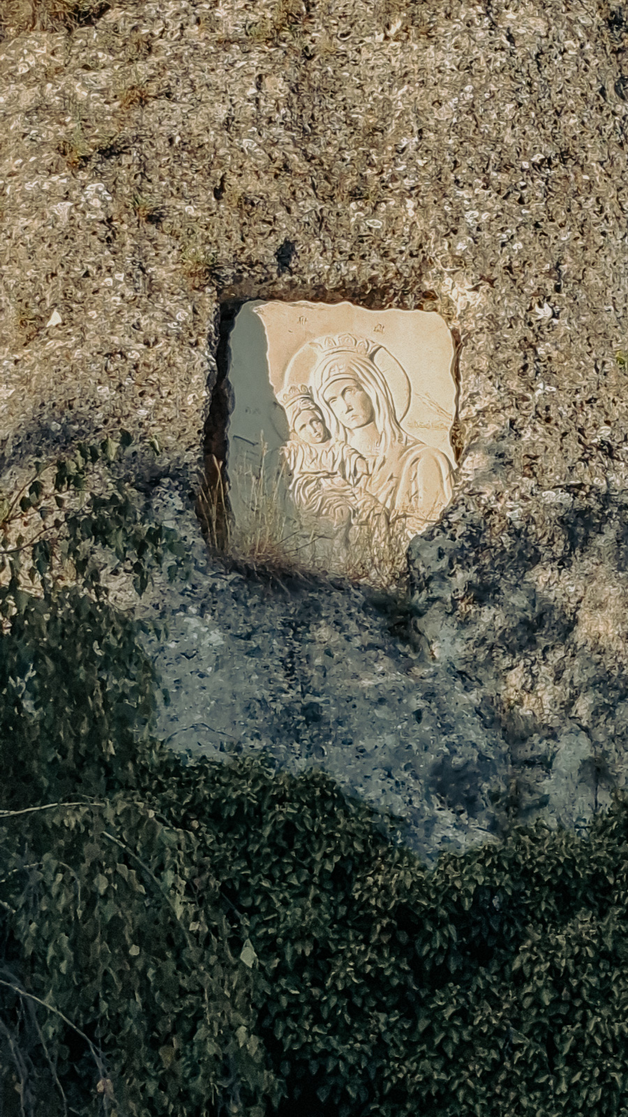a carved stone icon in the rocks