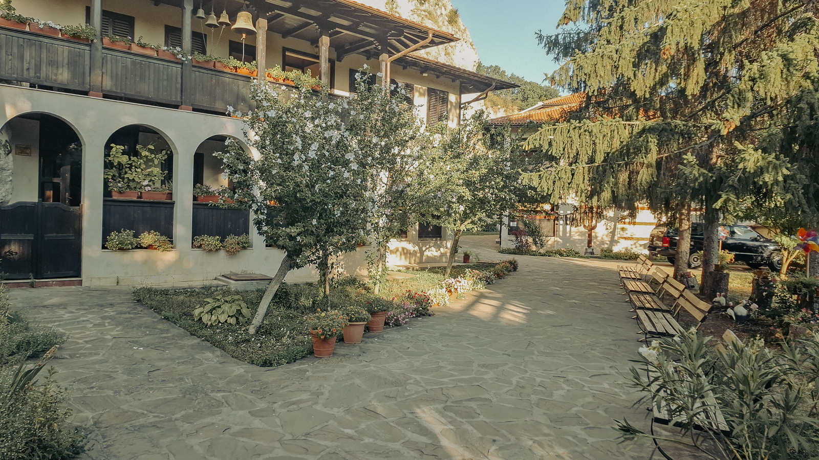view of the landscaped garden with the monastery where monks live