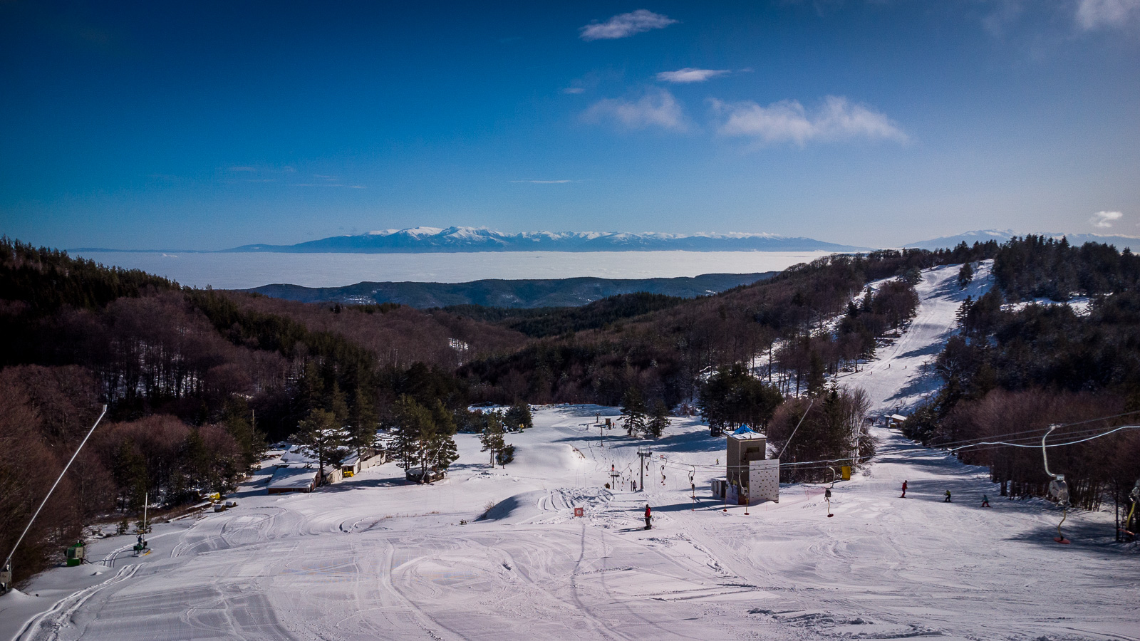 ski slopes, lift, skiers and mountains