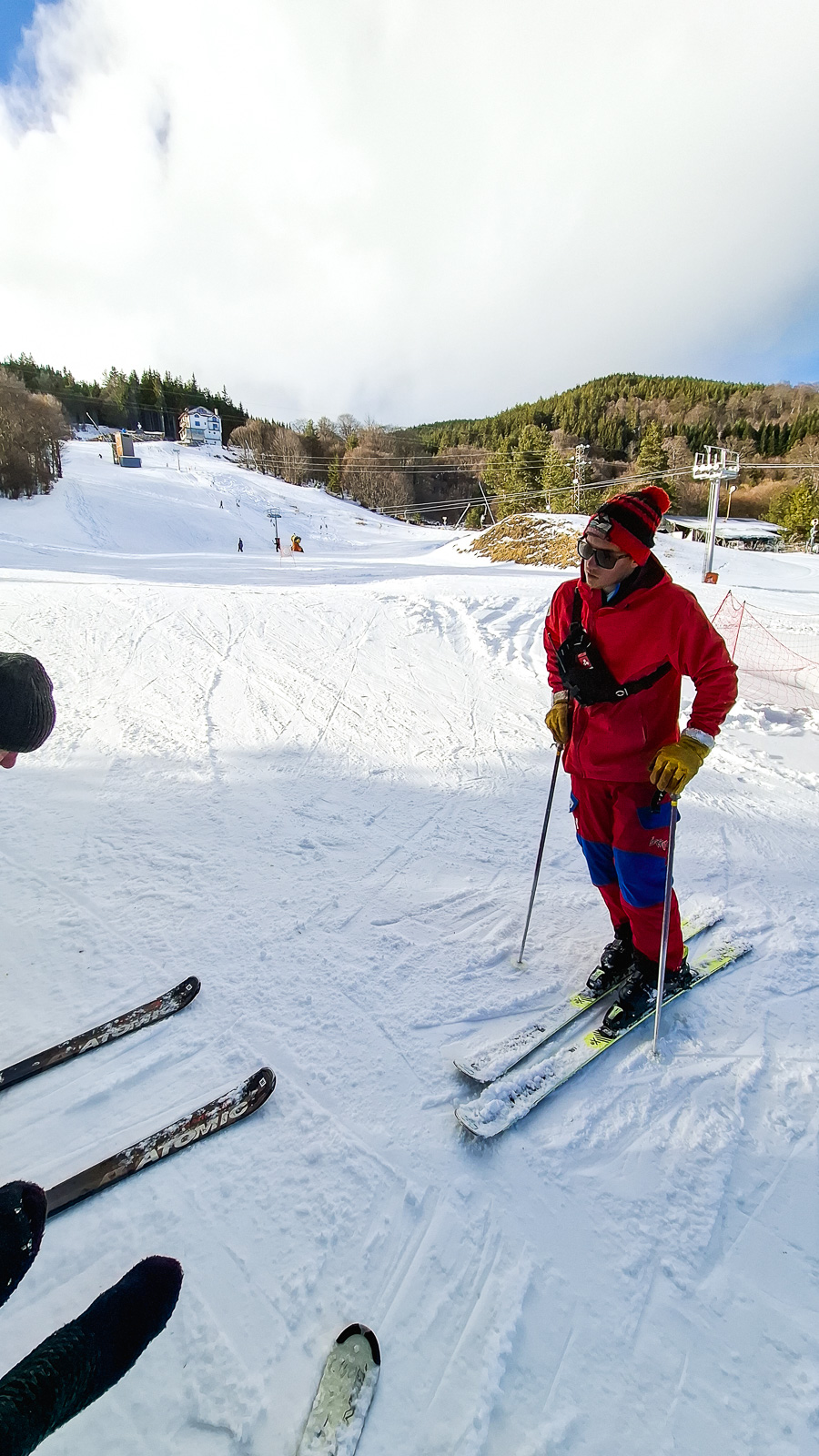 Ski instructor in red during a ski lesson