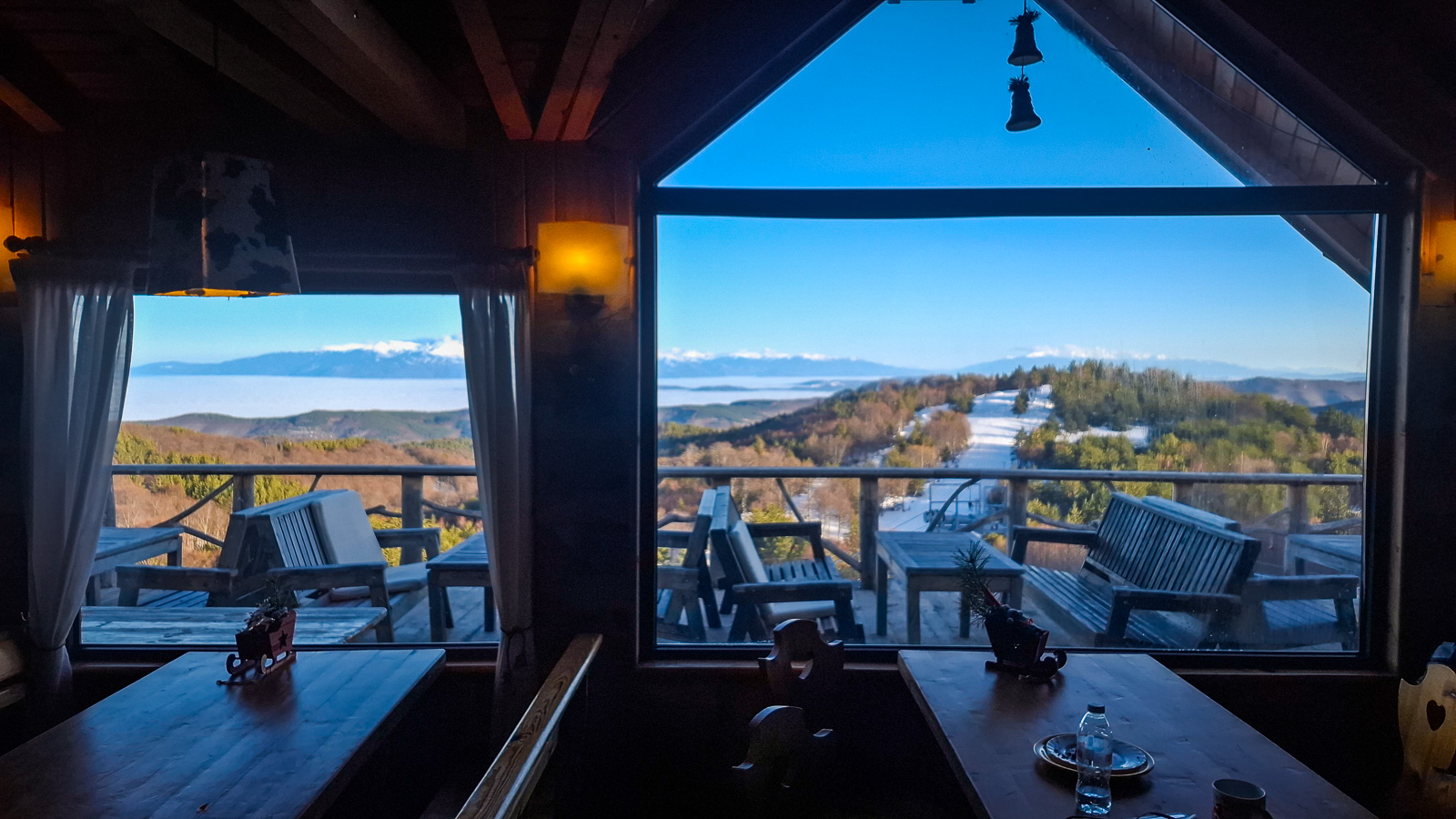 View from the inside of the tea house towards the ski resort and the mountains