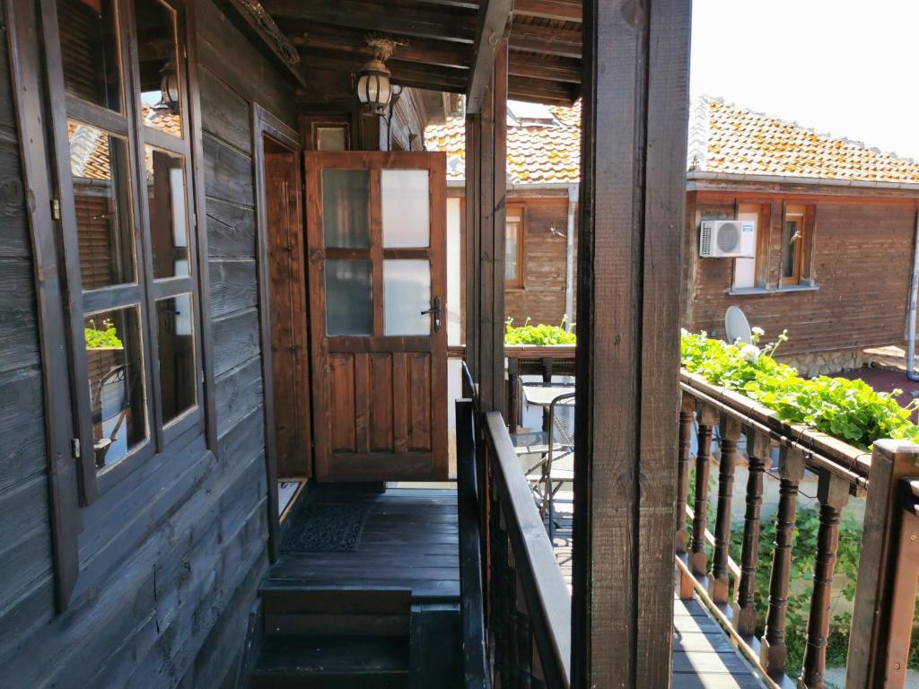 The Old House - wooden balcony view - affiliate link